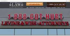A competing vanity phone number advertised across the top of a personal injury lawyer's website