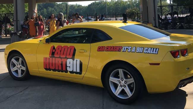 personal injury vanity number advertising on car wrapped with 1-800-HURT-911