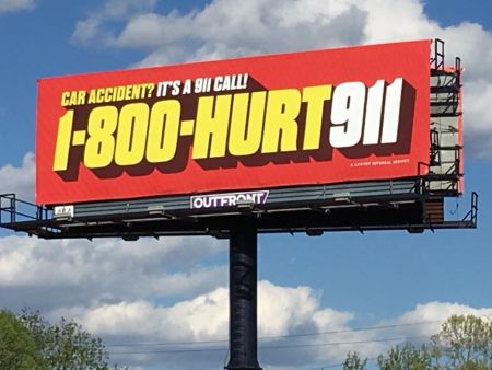 a lawyer advertising for car accidents on a billboard with 1-800-HURT-911®