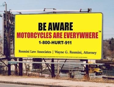 Large billboard by an attorney advertising motorcycle awareness