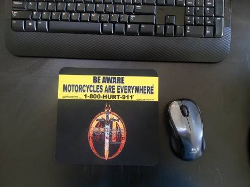 mouse pad advertising motorcycle awareness, advertising for motorcycle attorneys, & co-branding with a motorcycle magazine