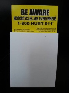 refrigerator magnet with notepad advertising motorcycle awareness and attorneys