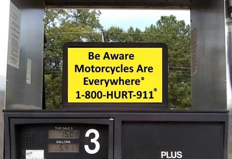 Motorcycle Awareness Sign on Gas Pumps advertising personal injury lawyers at 1-800-HURT-911®