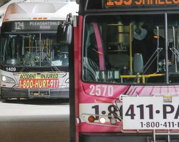 Photo from article about bus expansion shows 1-800-HURT-911 billboard