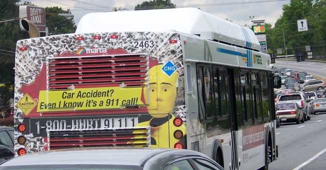 Lawyer advertising billboard with 1-800-HURT-911 on back of bus